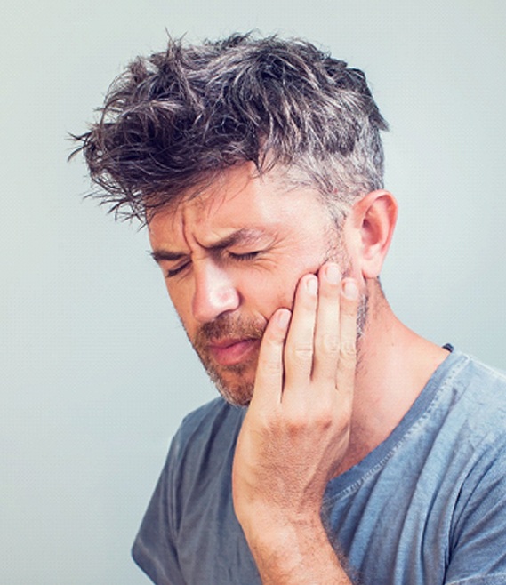 Man with a failed dental implant in Panama City