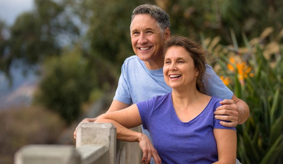 Older couple enjoying benefits of dental implants in Panama City
