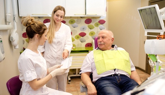 Implant dentist in Panama City speaking with a patient