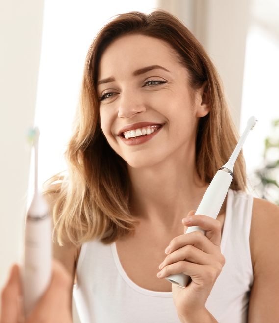 Woman smiling after brushing her teeth