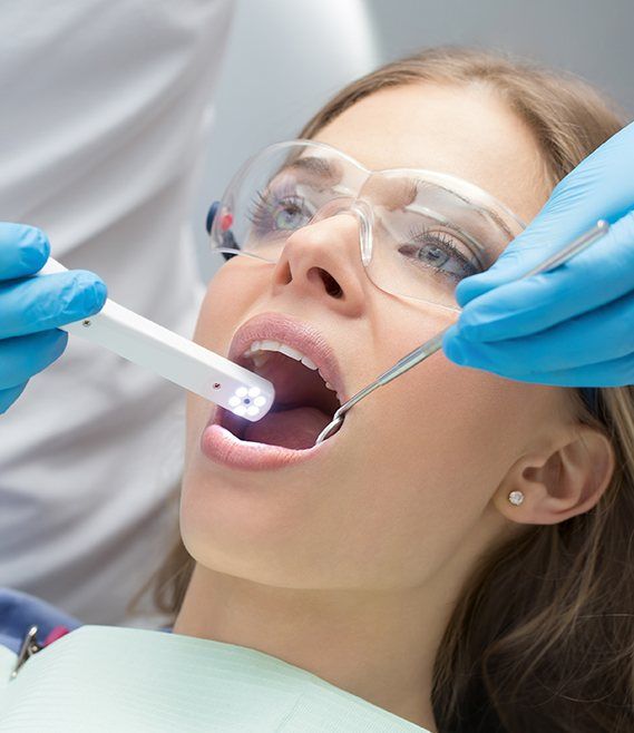 Dentist using intraoral camera to capture smile images