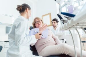 a patient speaking with a dentist