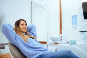 Calm dental patient relaxing in treatment chair 